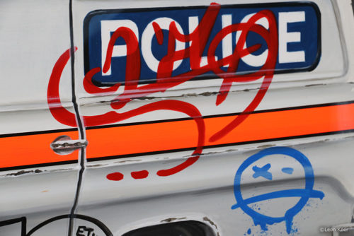 Tagged Police Car by Leon Keer